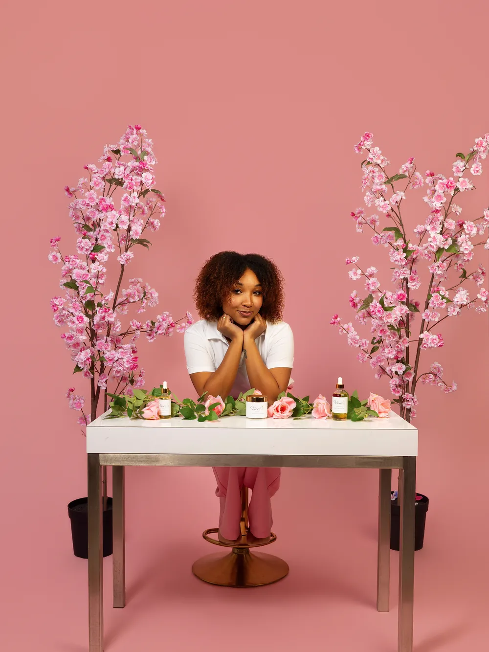 The Vioré collection styled with roses and eucalyptus on a white table